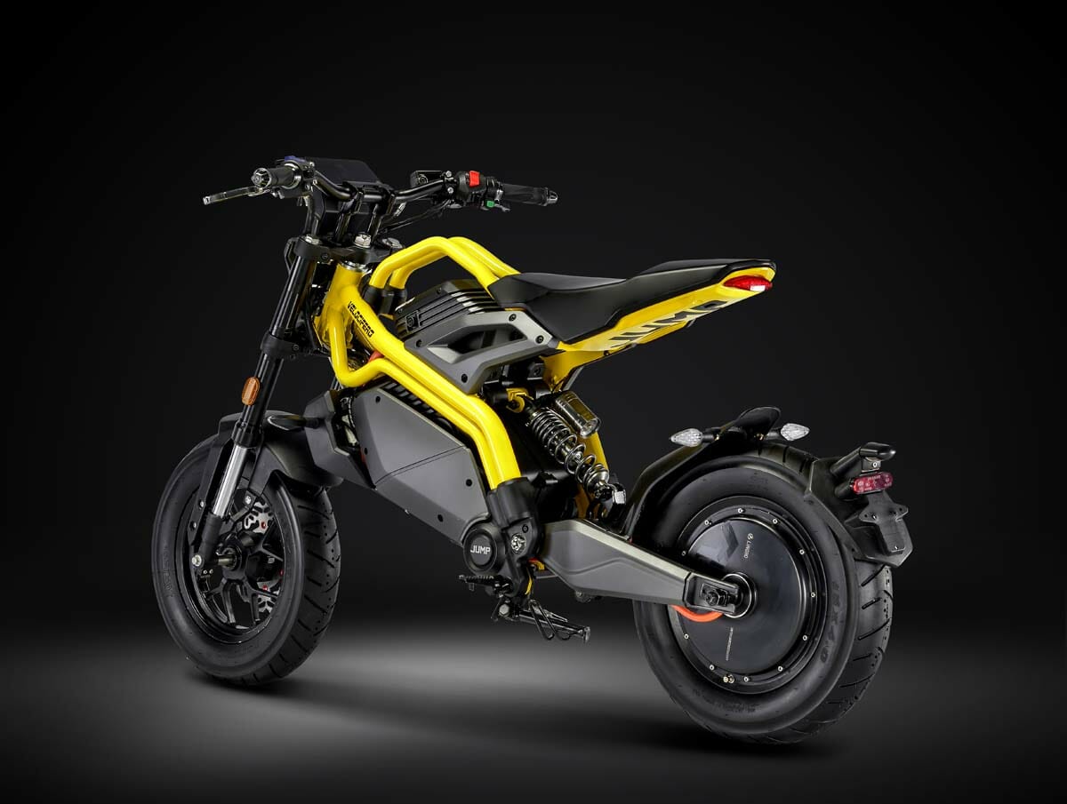 A yellow and black electric motorcycle is displayed against a dark background, showcasing its modern design and rear-wheel focus.