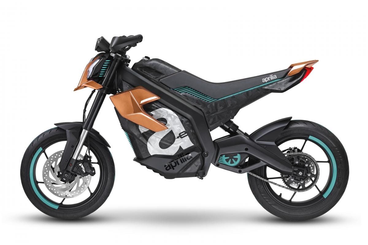 A matte black and orange motorcycle with sleek design and stylized number decals is shown against a plain white background.