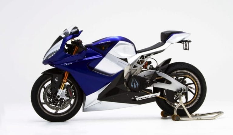 A sleek, modern blue and white sport motorcycle on a white background, positioned on a rear stand.