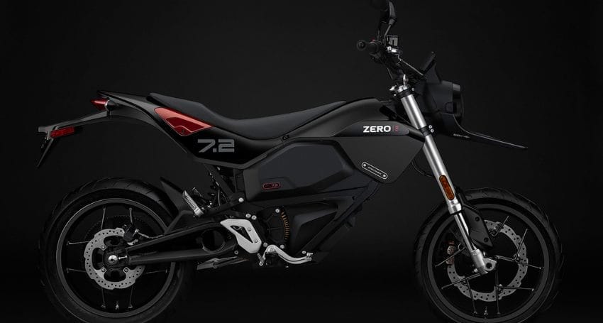 A black motorcycle with a black background.