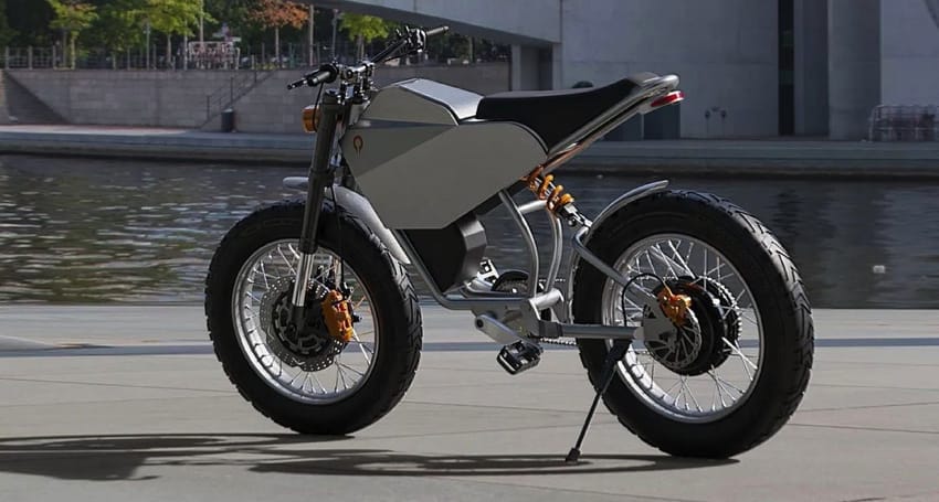 A sleek, modern electric motorcycle with a minimalist design is parked on a concrete surface near a body of water and urban structures in the background.