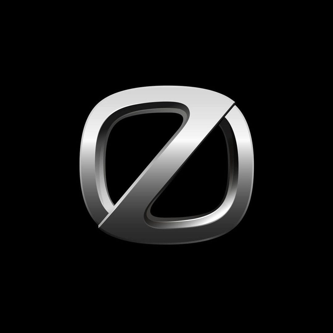 A stylized metallic letter "O" with a diagonal cut through it, creating a partial "Z" shape, against a black background.