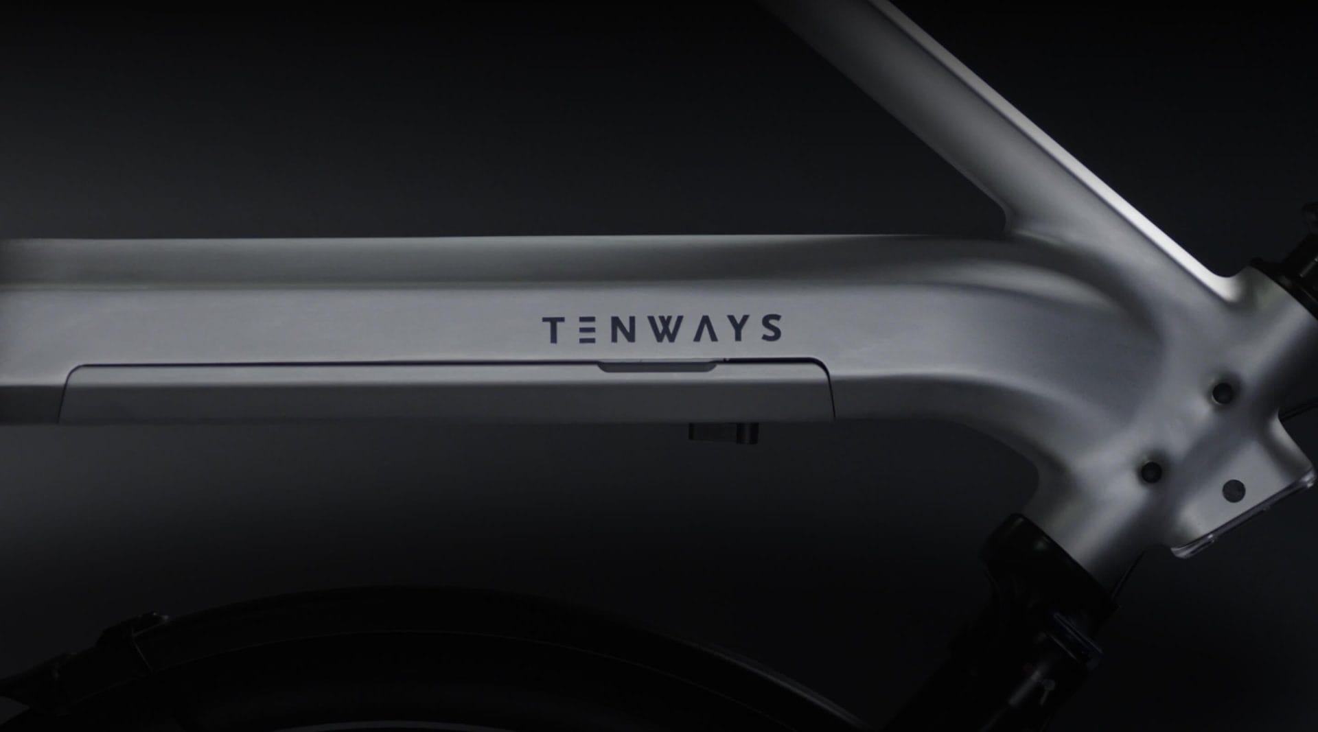 Close-up of a Tenways e-bike frame, showcasing the minimalist and sleek design with a focus on the brand logo.