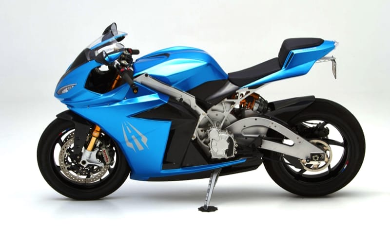 A blue sport motorcycle with a sleek design and exposed frame displayed on a white background. The bike features aerodynamic fairings, a single rear seat, and a kickstand.