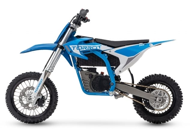 Side view of a blue and white dirt bike with "TORROT" written on the frame. The bike has knobby tires, a black seat, and a robust suspension system.