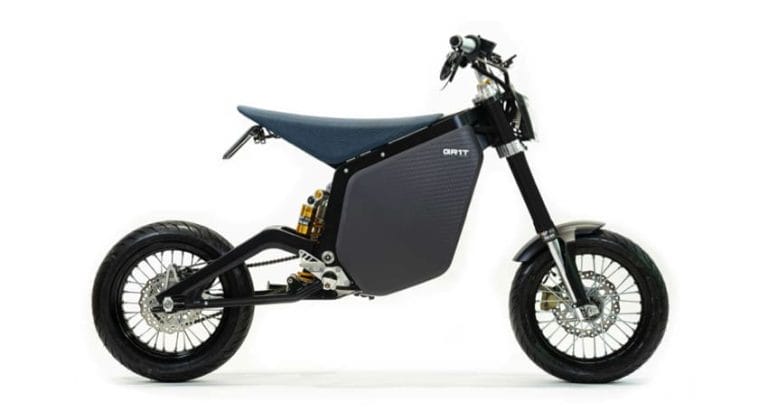 Side view of a sleek, black electric dirt bike with knobby tires and a minimalist design.