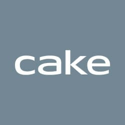 A gray background with the word "cake" written in white lowercase letters.