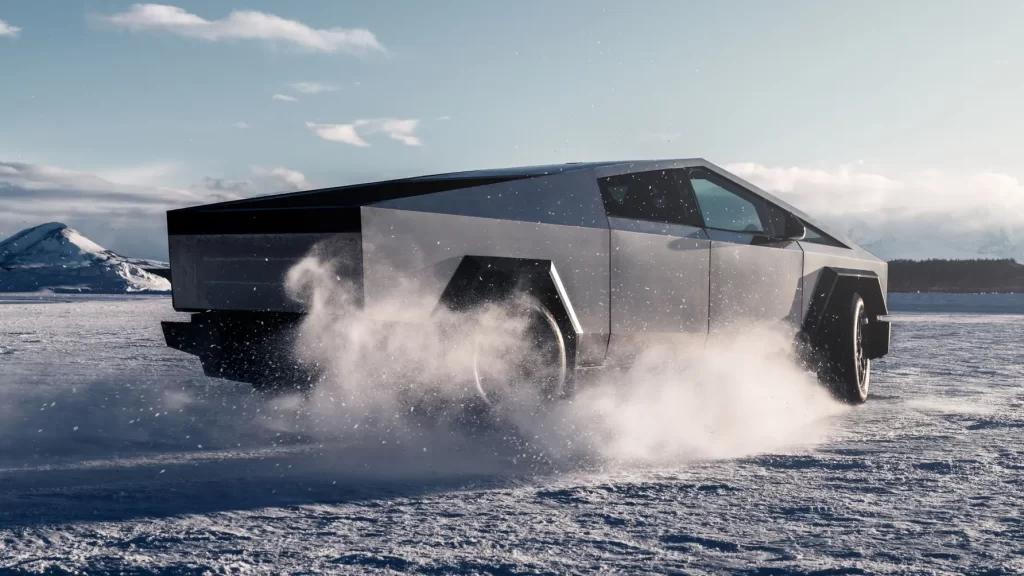 White vehicle, snowy field.