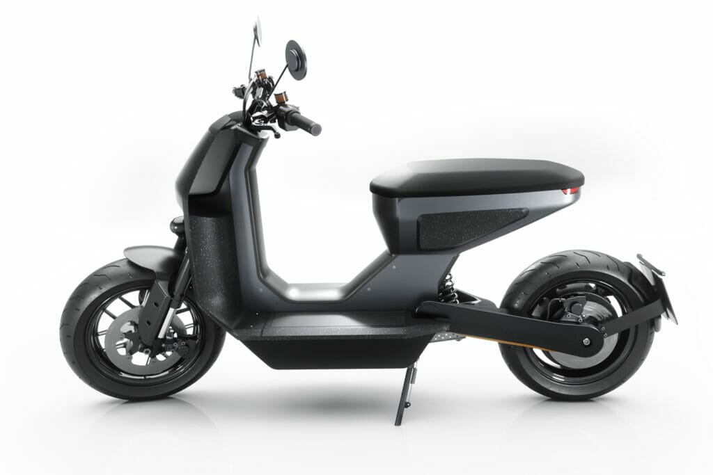 A black electric scooter on a white background.