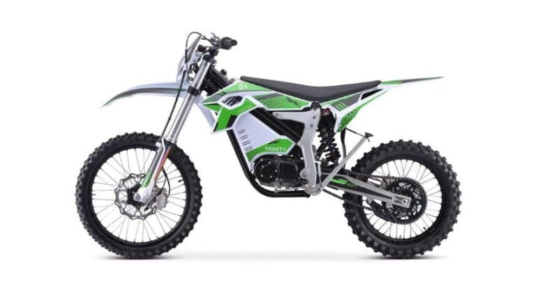 Side view of a green and black electric dirt bike with thick tires, elevated seat, and minimalist frame.