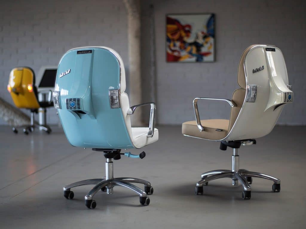 A pair of office chairs in a blue and white color scheme.