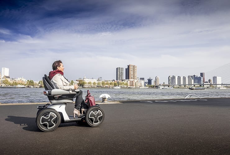 A man on a mobility scooter.