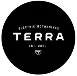 Circular logo with white text on a black background reading "Electric Motorbikes Terra Est. 2020" with a small shield emblem at the bottom.