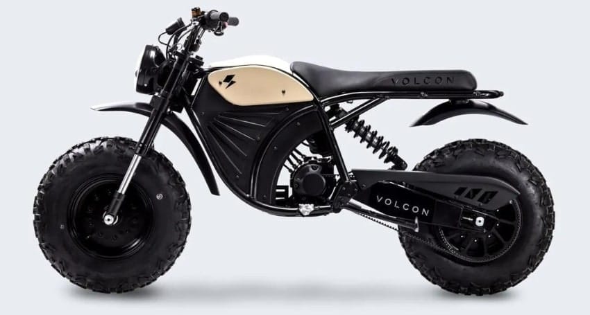 A black Volcon motorcycle with a rugged design, featuring large off-road tires, visible suspension, and a minimalist frame against a plain background.