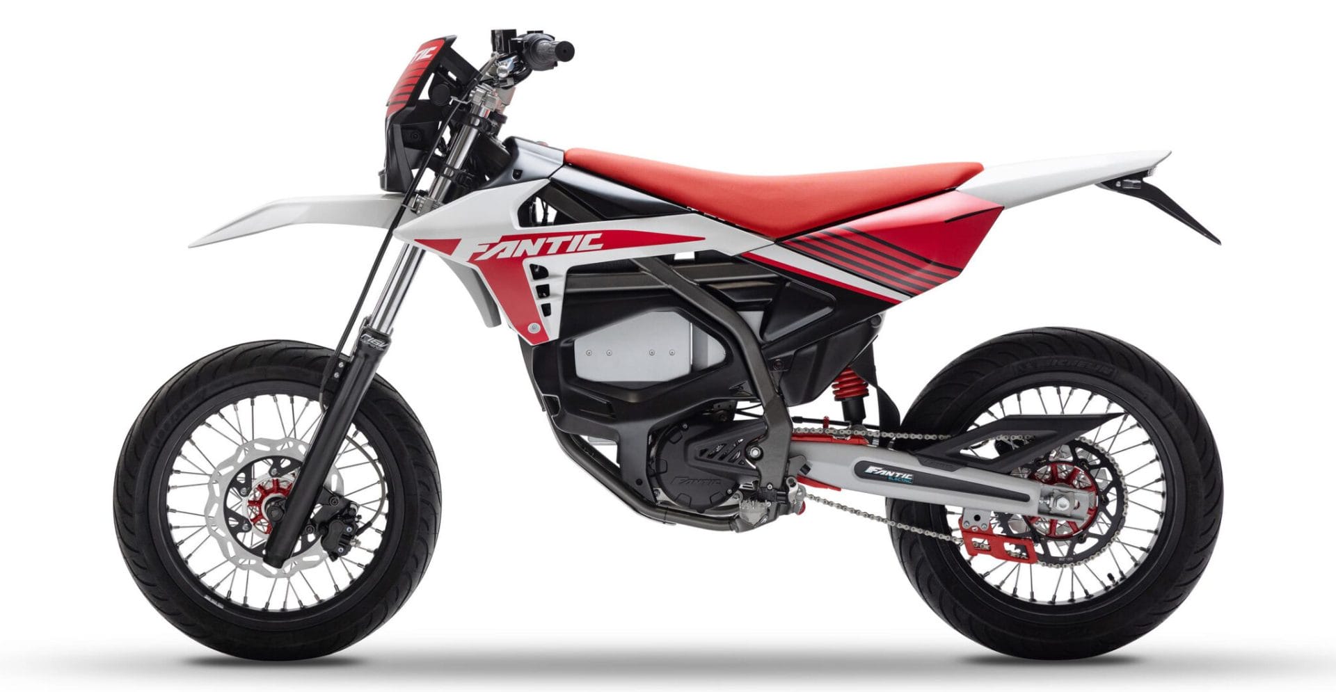 A red and white Fantic dirt bike with black tires and a black frame, viewed from the side against a white background.