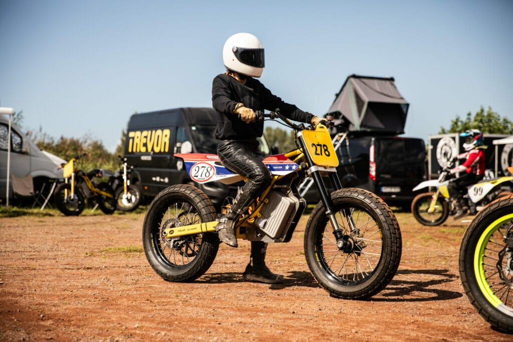 A person riding a dirt bike on a dirt 