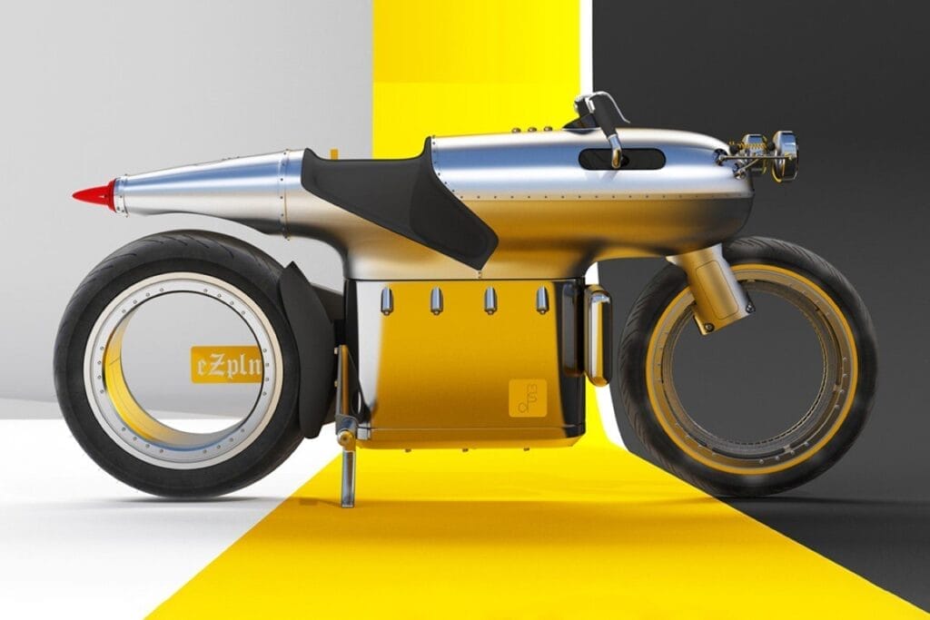 A silver and yellow motorcycle on a yellow and black background.