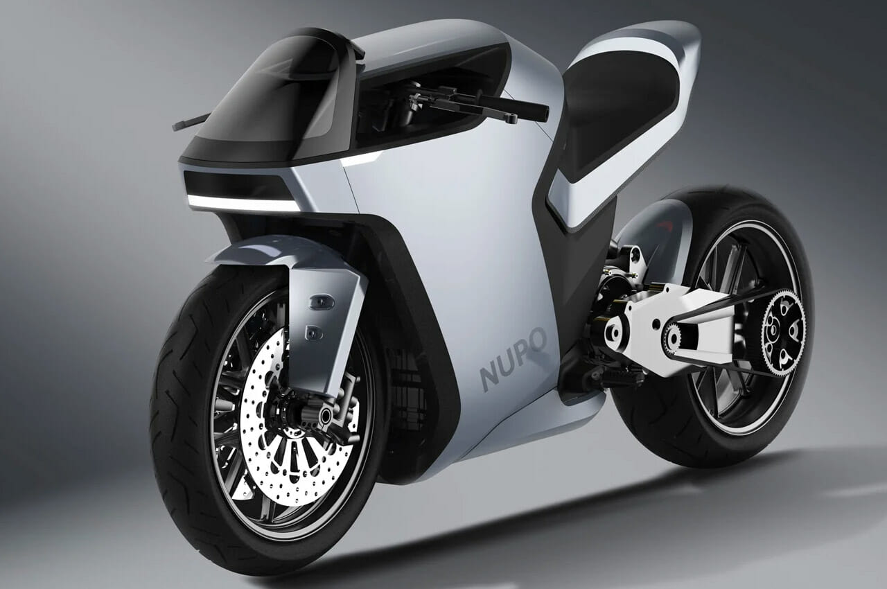 Sleek futuristic motorcycle with a silver body, front disc brakes, black saddle, aerodynamic design, and the word "NURO" on the side, standing on a grey surface.